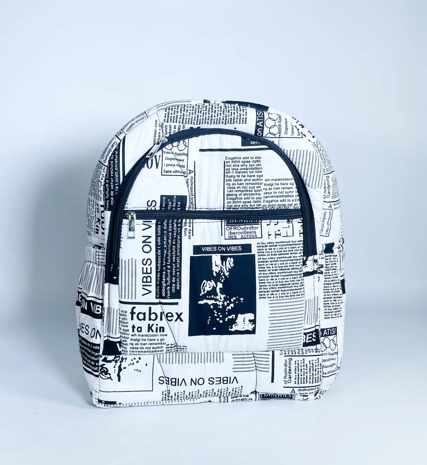 White & Black Newspaper Print Backpack